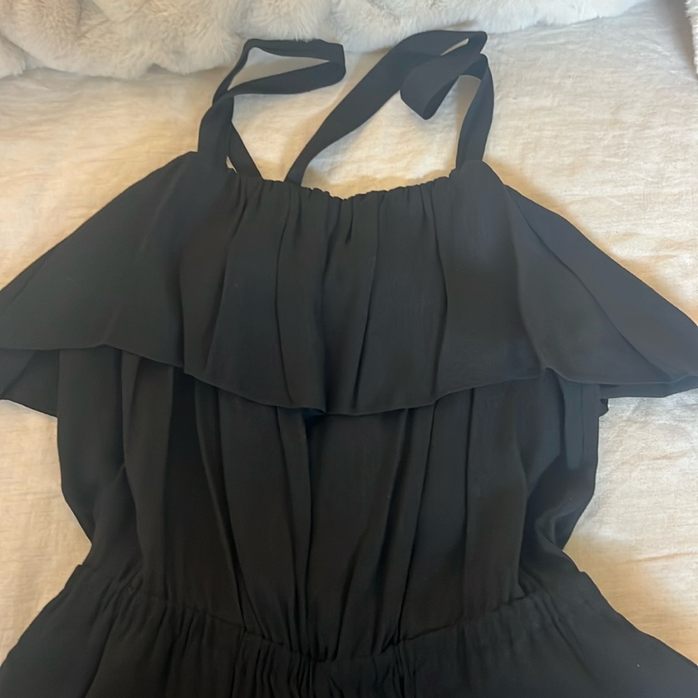 Black romper with ruffle top